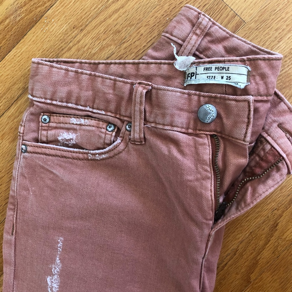 Burnt orange Free People distressed skinny jeans